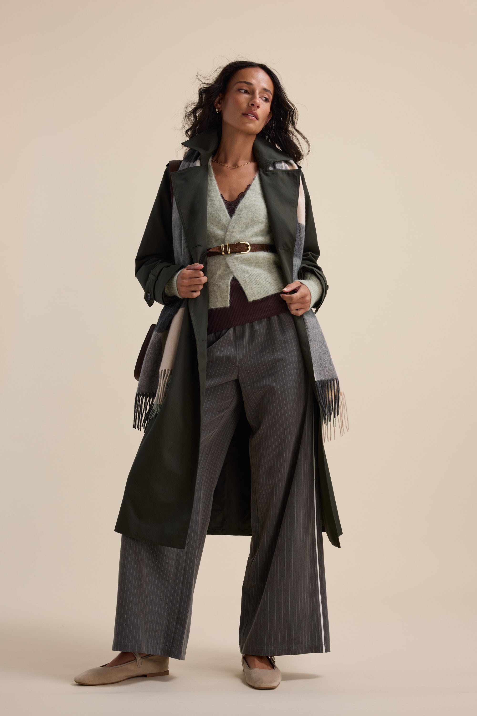 Woman in The Ultimate Luxe Cardigan by Max, standing confidently.