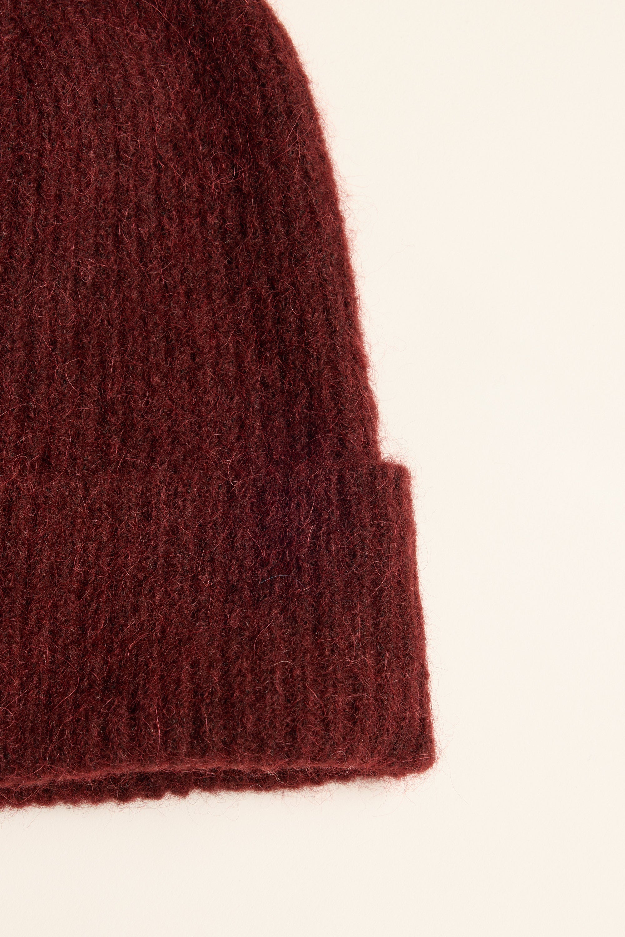 Close-up of Max Georgia Luxe Whisper Knit Beanie in wool and alpaca on a light background.