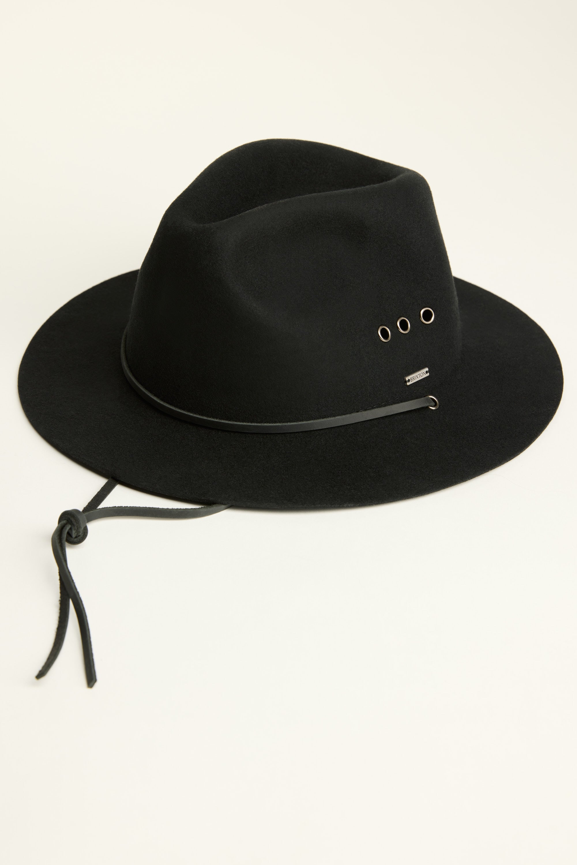 The Brixton Wesley AW Fedora by Brixton is a black wool felt hat featuring a leather band, metal side eyelets, and a leather chin strap, shown on a light background.