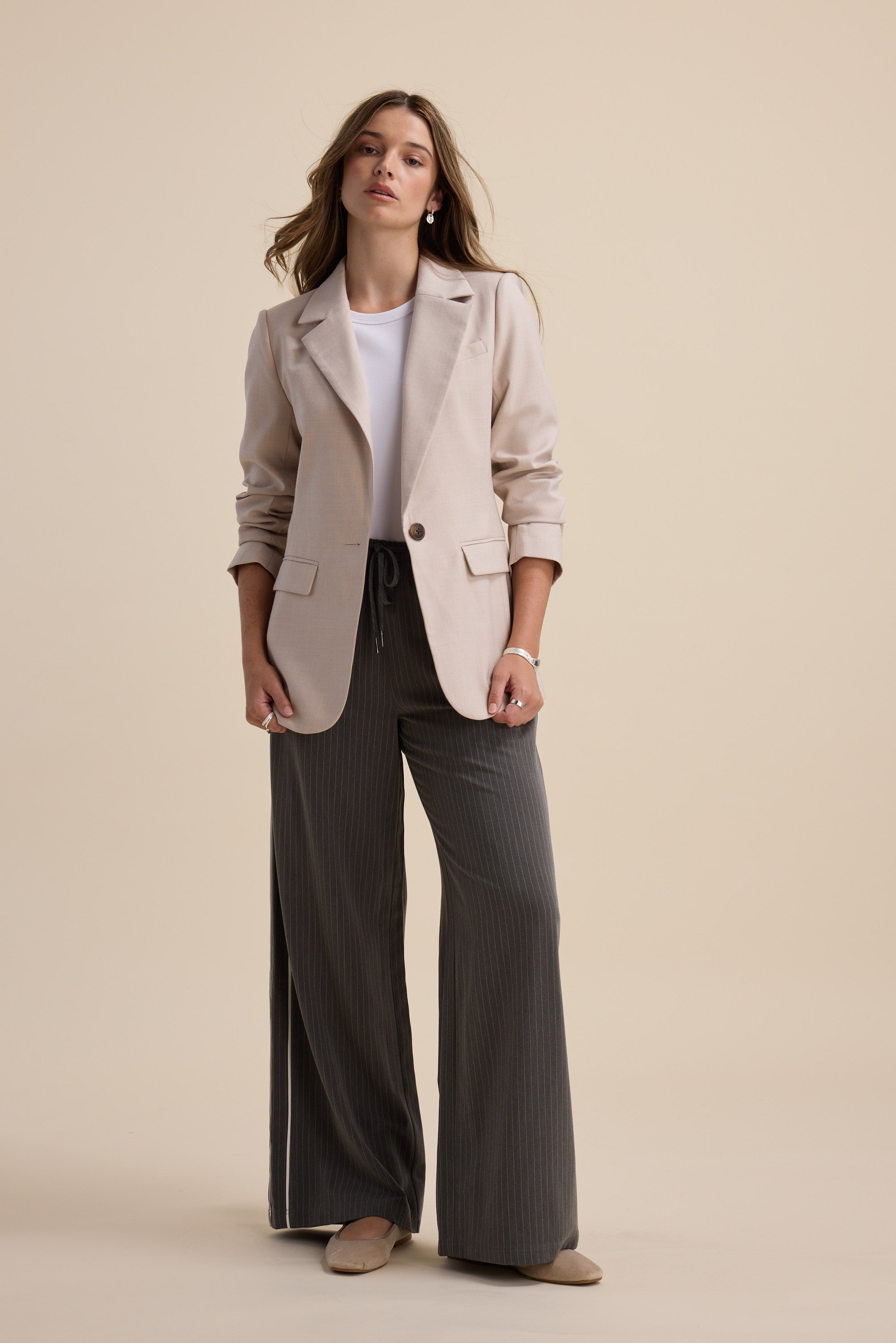 Max’s The Wool Blend Blazer, styled with a white top and gray wide-leg pants—effortless staples.