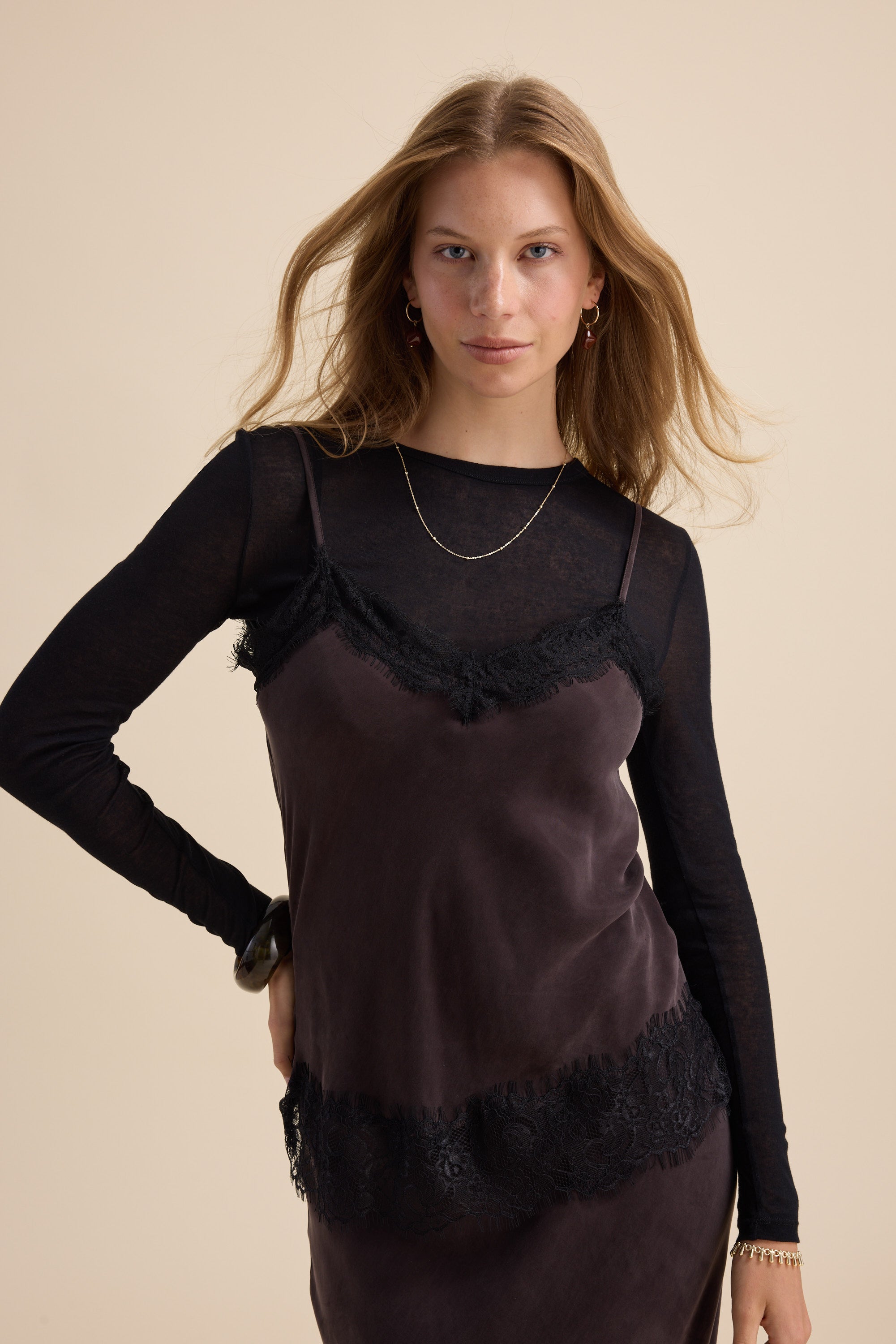 Woman in the Lola Lace Detail Cami by Max, crafted from a soft cupro blend fabric.