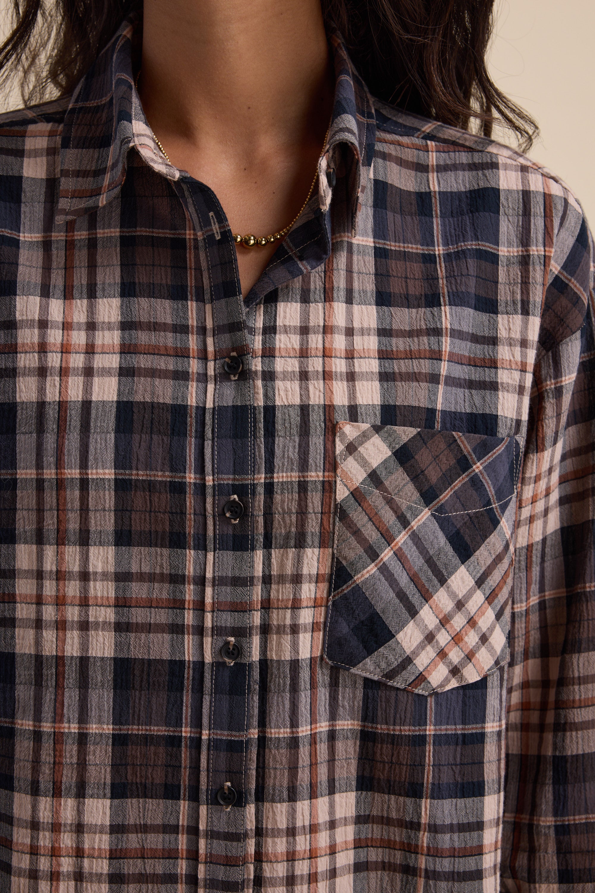 Person wearing the Elementary Textured Shirt in blue, white, and brown with a front pocket.