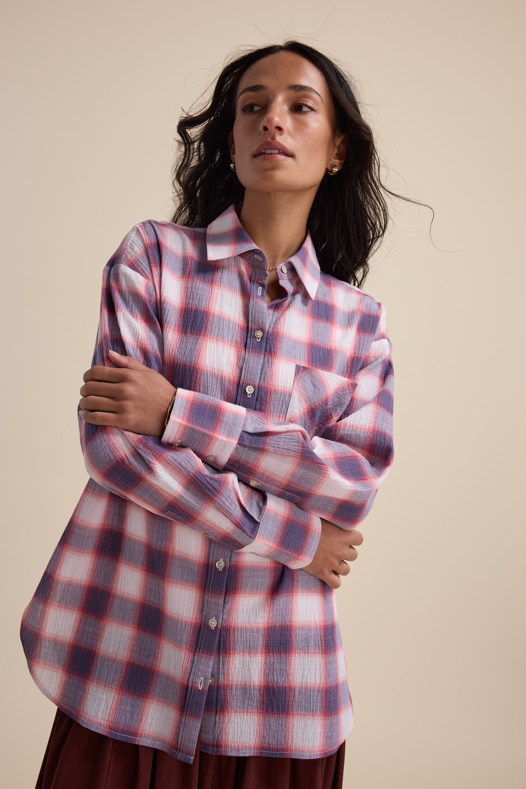 Woman wears the Elementary Textured Shirt by Elementary, standing with arms crossed.