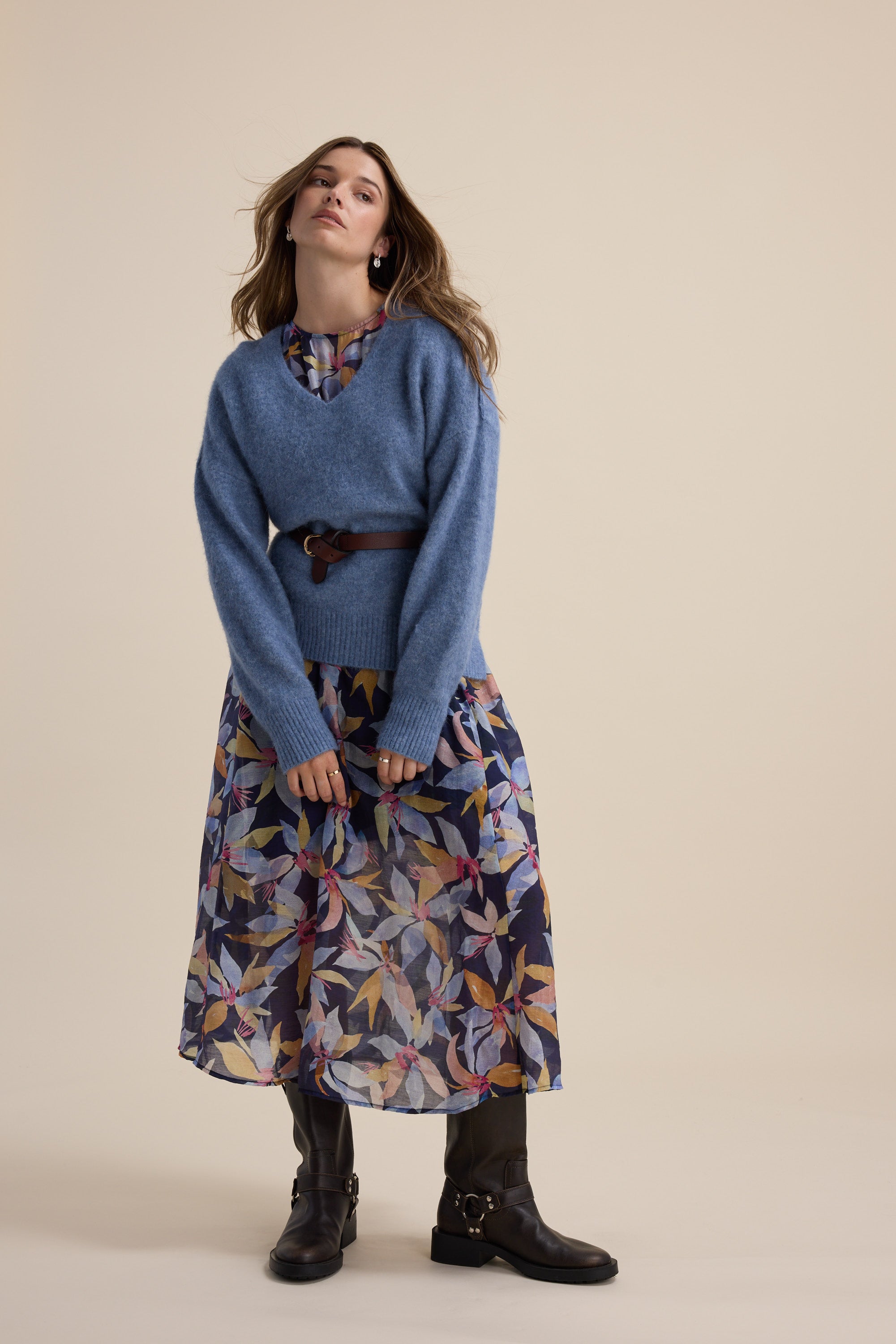 Woman in the Max Ava Gather Waist Dress and a blue sweater, styled with black boots indoors.