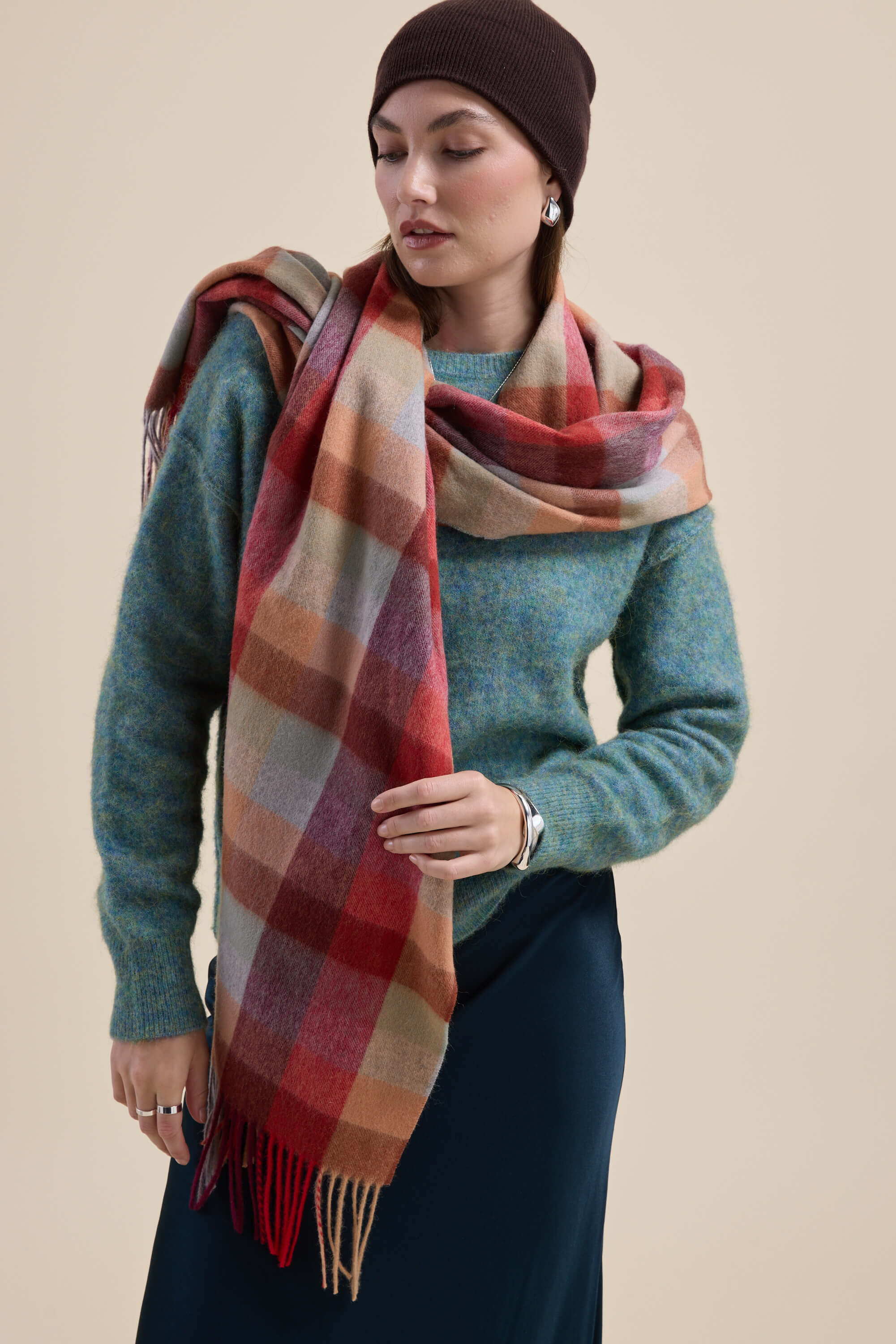 Woman wears Max Devon Luxe Whisper Crew Neck Sweater, checked scarf, and brown hat.