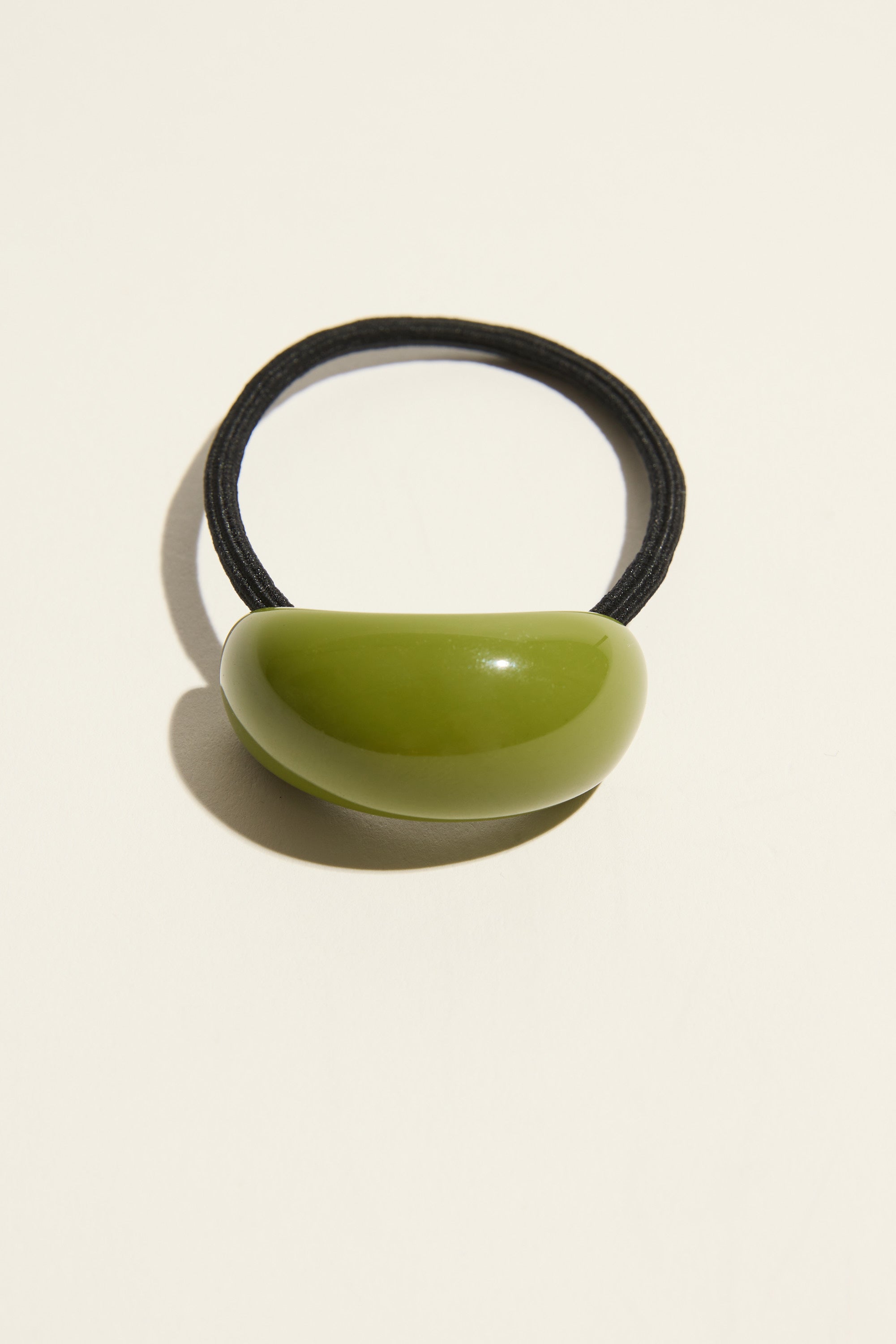 Janey Resin Hair Tie by Max: glossy green, sculptural accessory for a polished hair look.