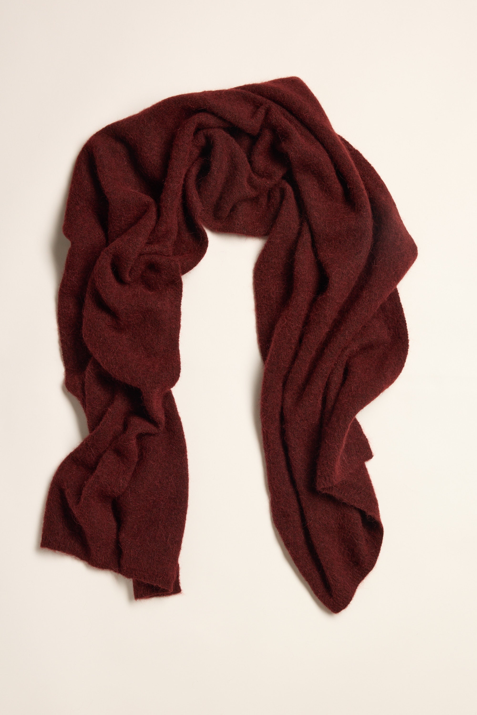 The Max Hailey Luxe Whisper Knit Scarf in burgundy displayed on a plain light background.