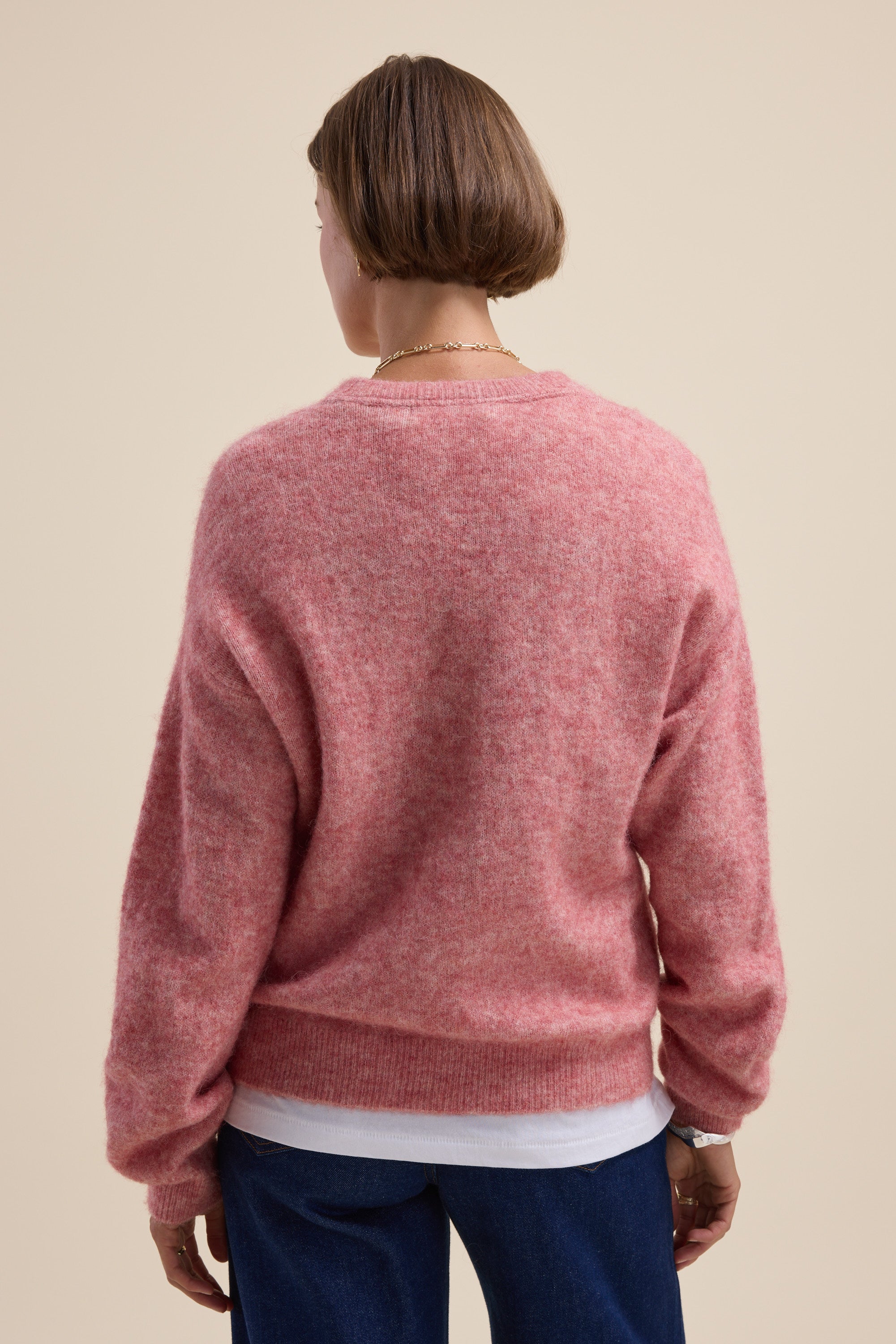 Person with short brown hair in a pink Max Hayley Luxe Whisper Crew Neck Sweater, facing away.
