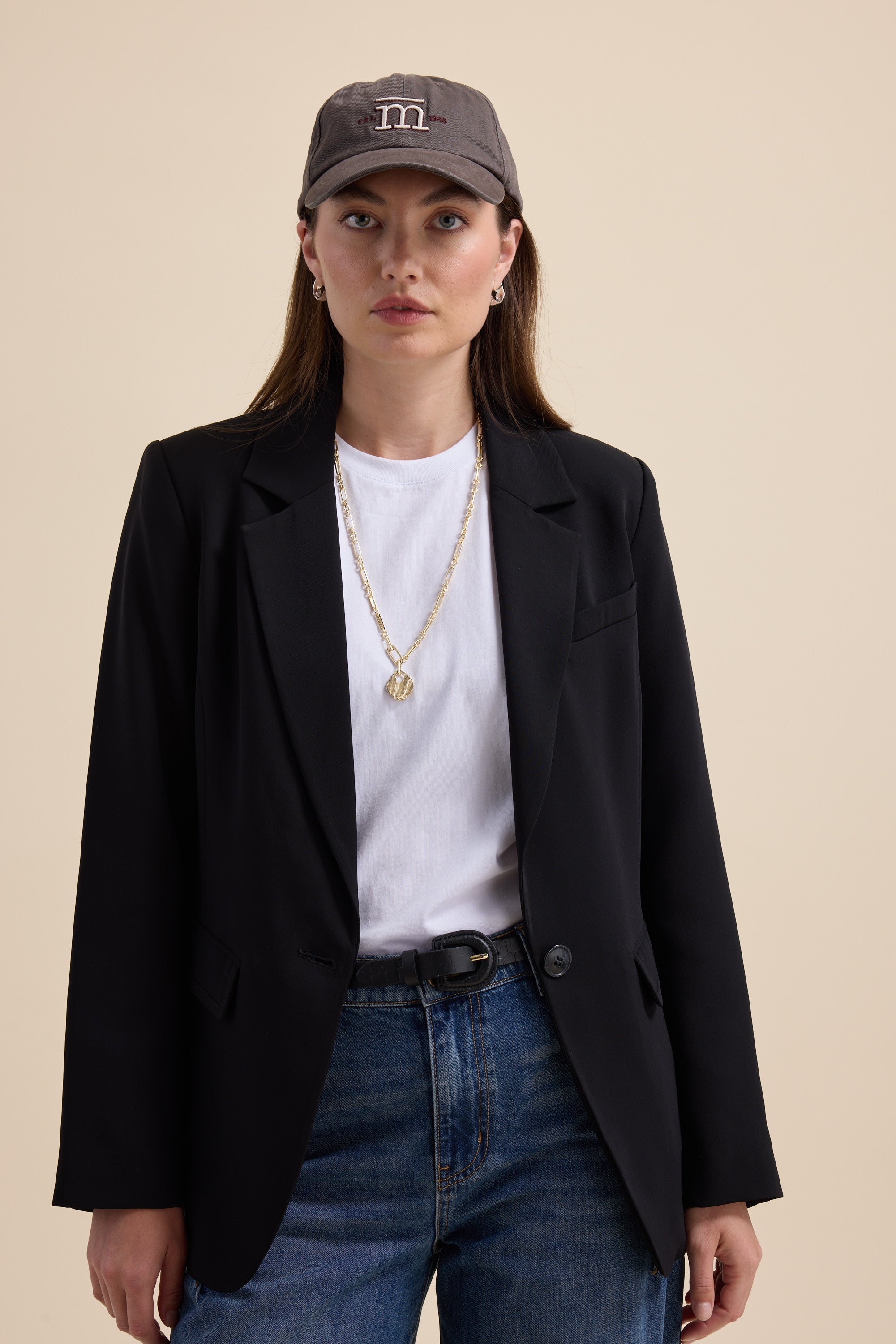 The All Occasion Blazer by Max—a timeless staple—stands out against a beige background.