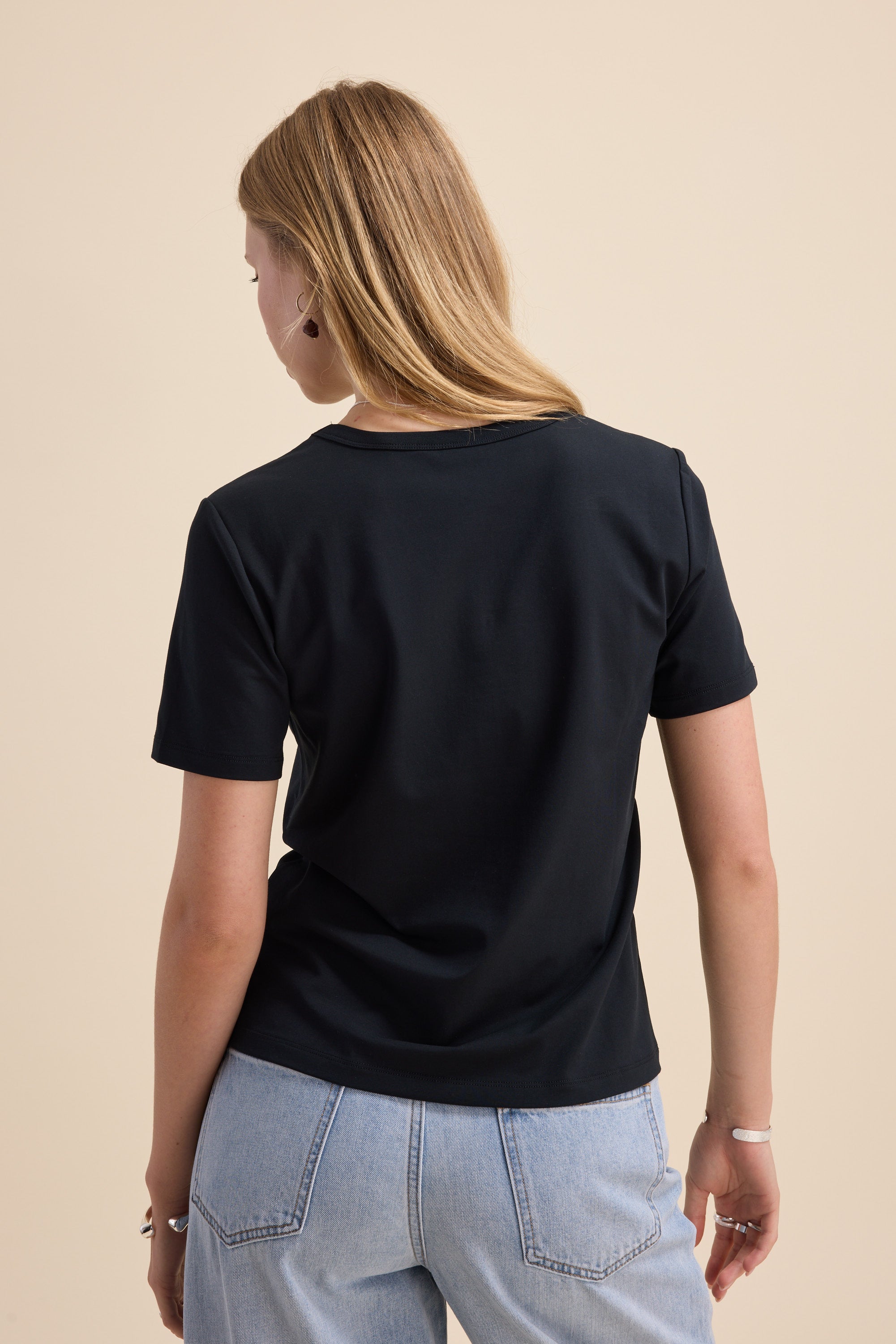 Woman in Max's The Perfect Short Sleeve V Neck Tee, a lightweight wardrobe staple.
