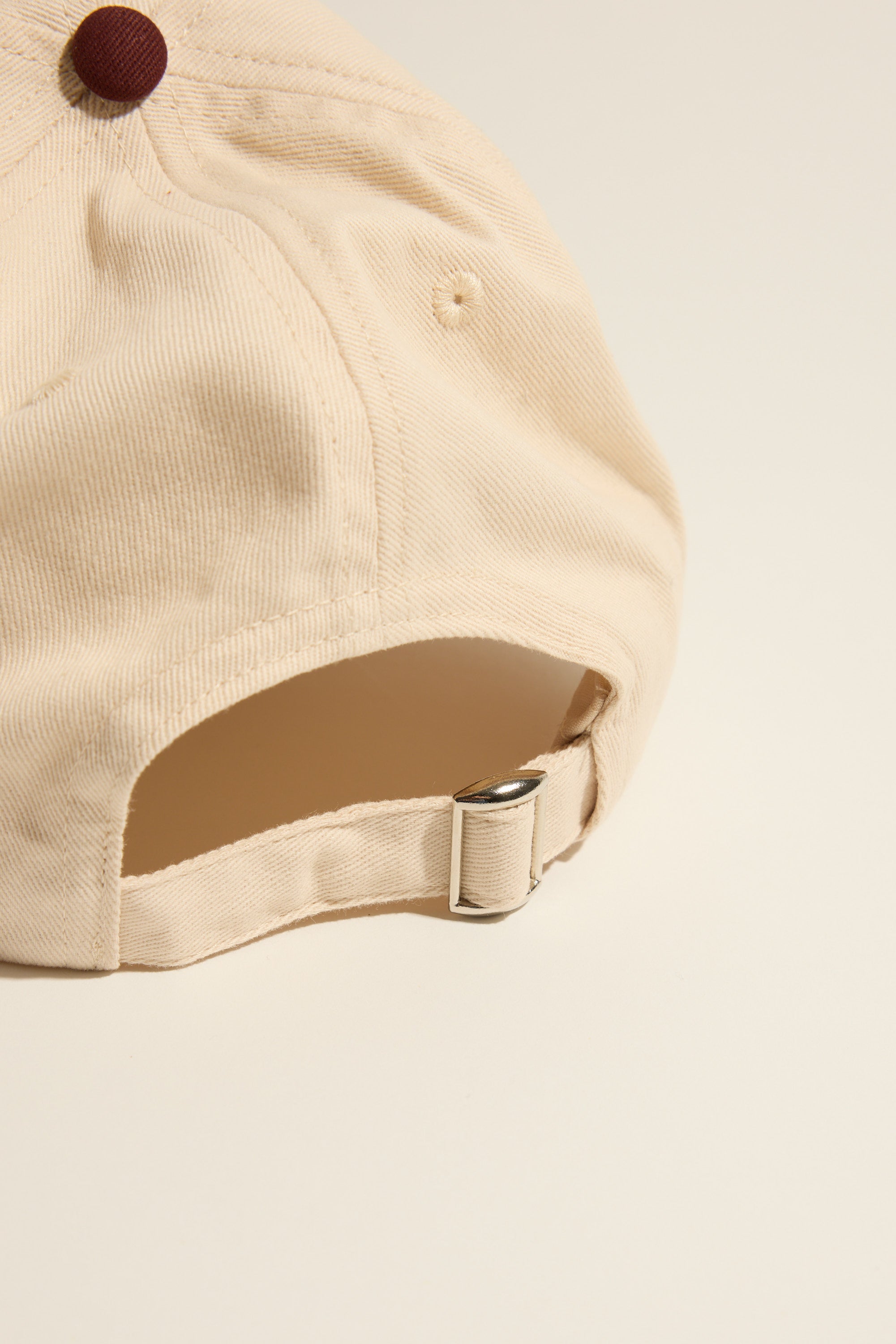 Max Elementary Contrast Brim Cap with adjustable back strap and metal buckle.