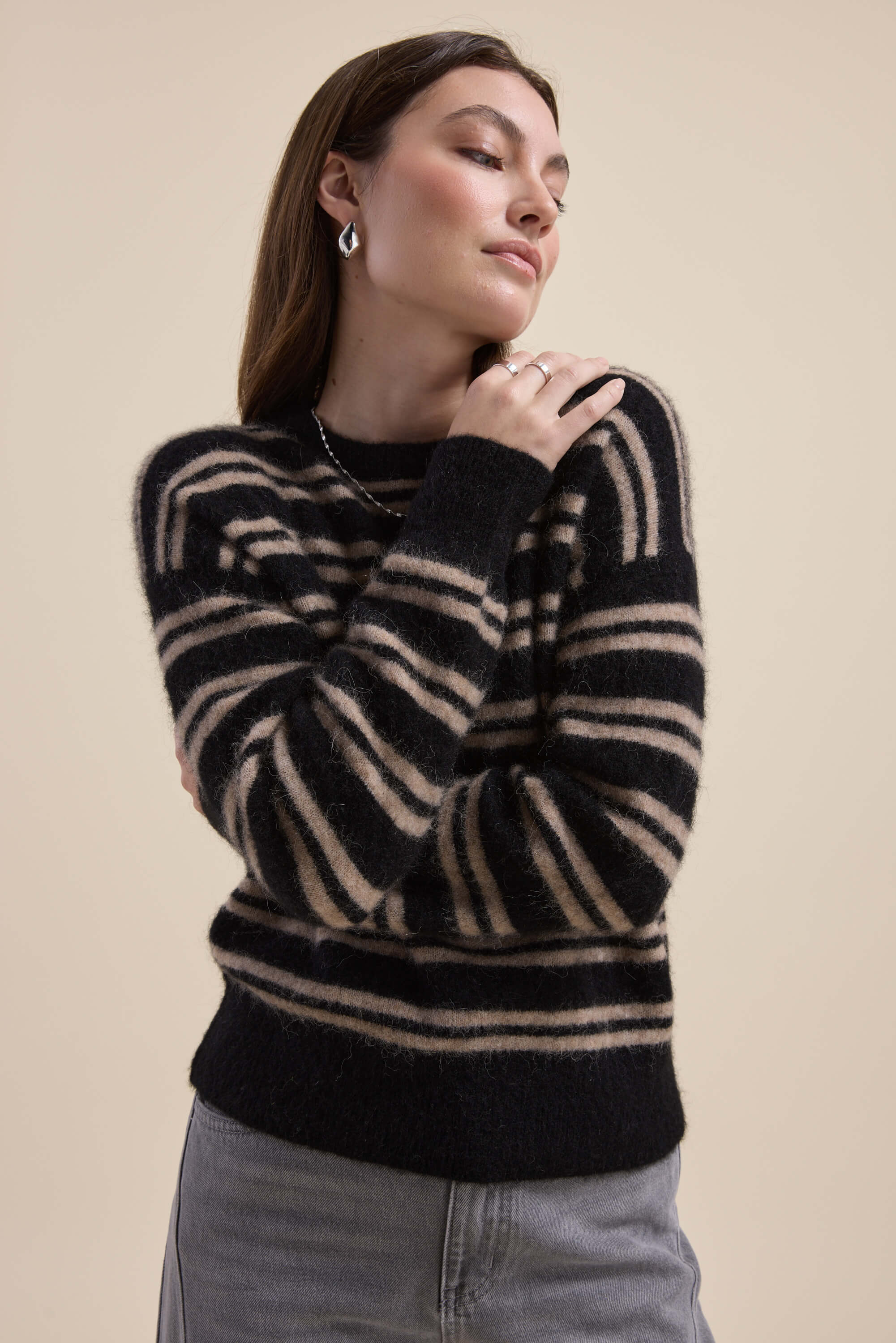 Woman in the Max Juno Luxe Whisper Sweater poses with arms crossed.