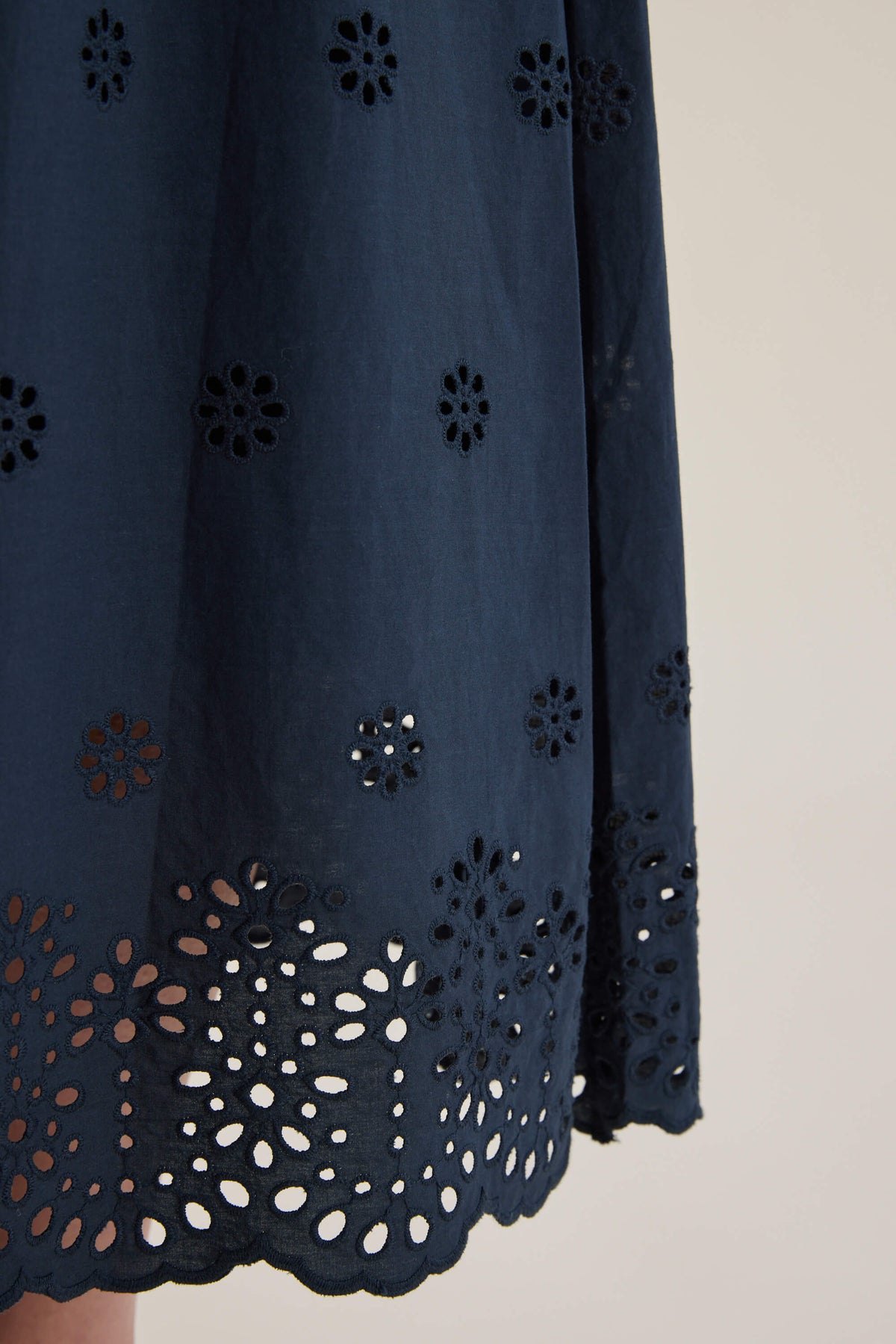 Elementary Broderie Detail Skirt by Elementary with floral eyelets and a scalloped hem.