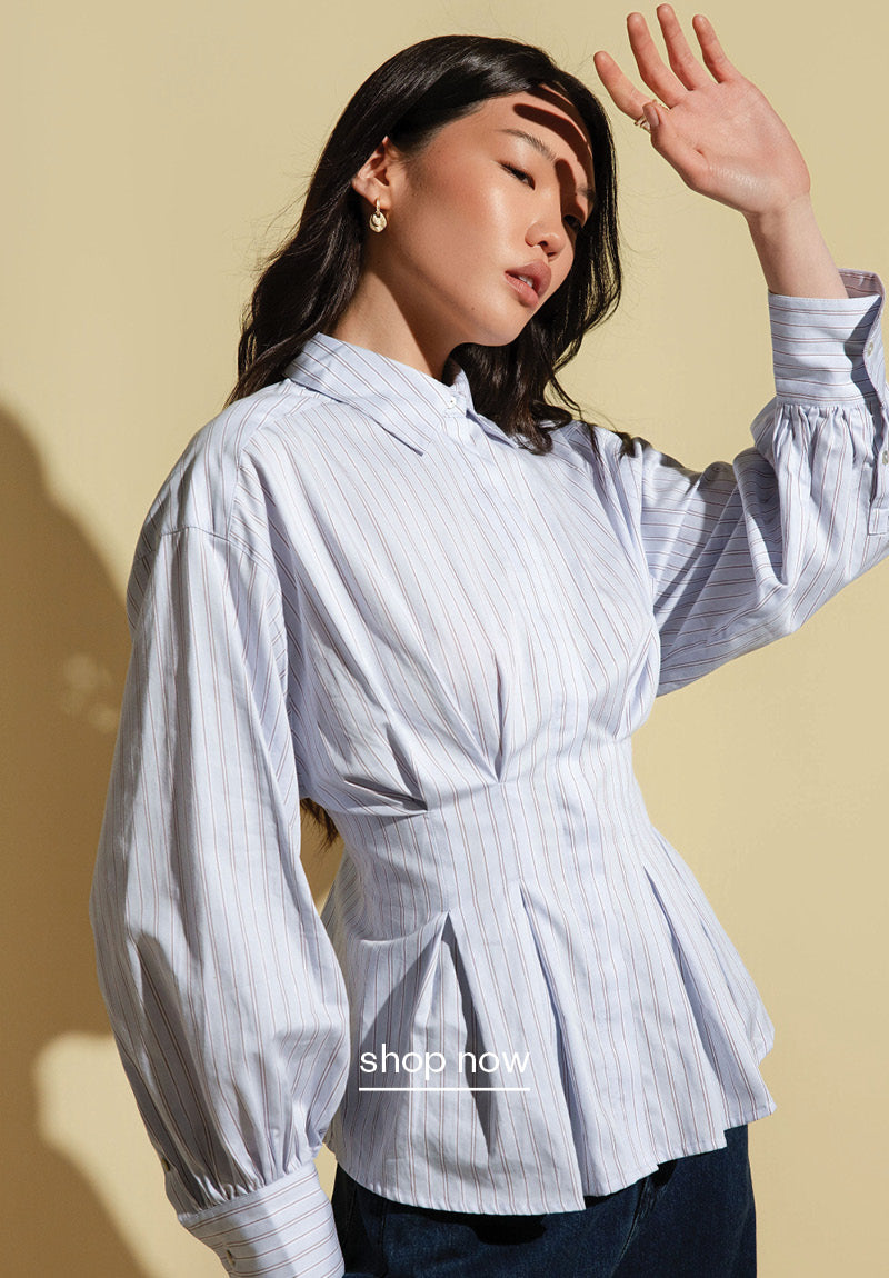 A woman wearing The Cinched Waist Shirt