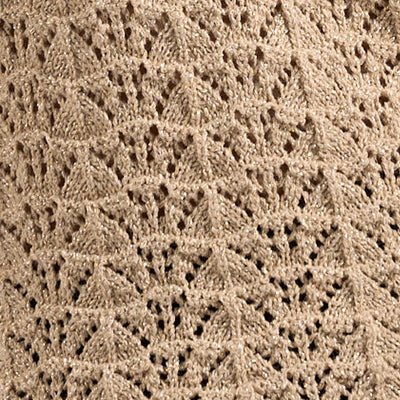 Close-up of NZ beige knitted fabric with a repeating chevron lace pattern.