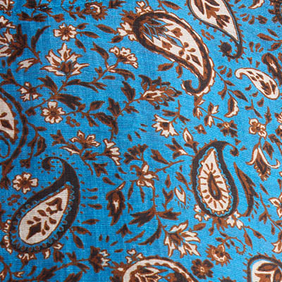 Blue NZ fabric with brown and cream paisley and floral patterns.