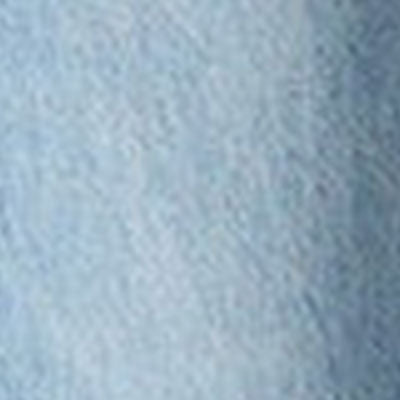 Close-up of light blue denim fabric texture.