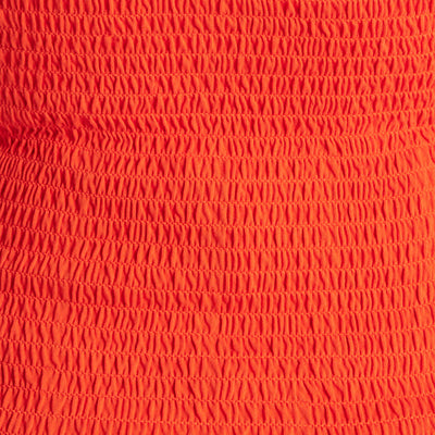 Bright orange fabric with a textured, ruched pattern and gathered, elasticized sections.